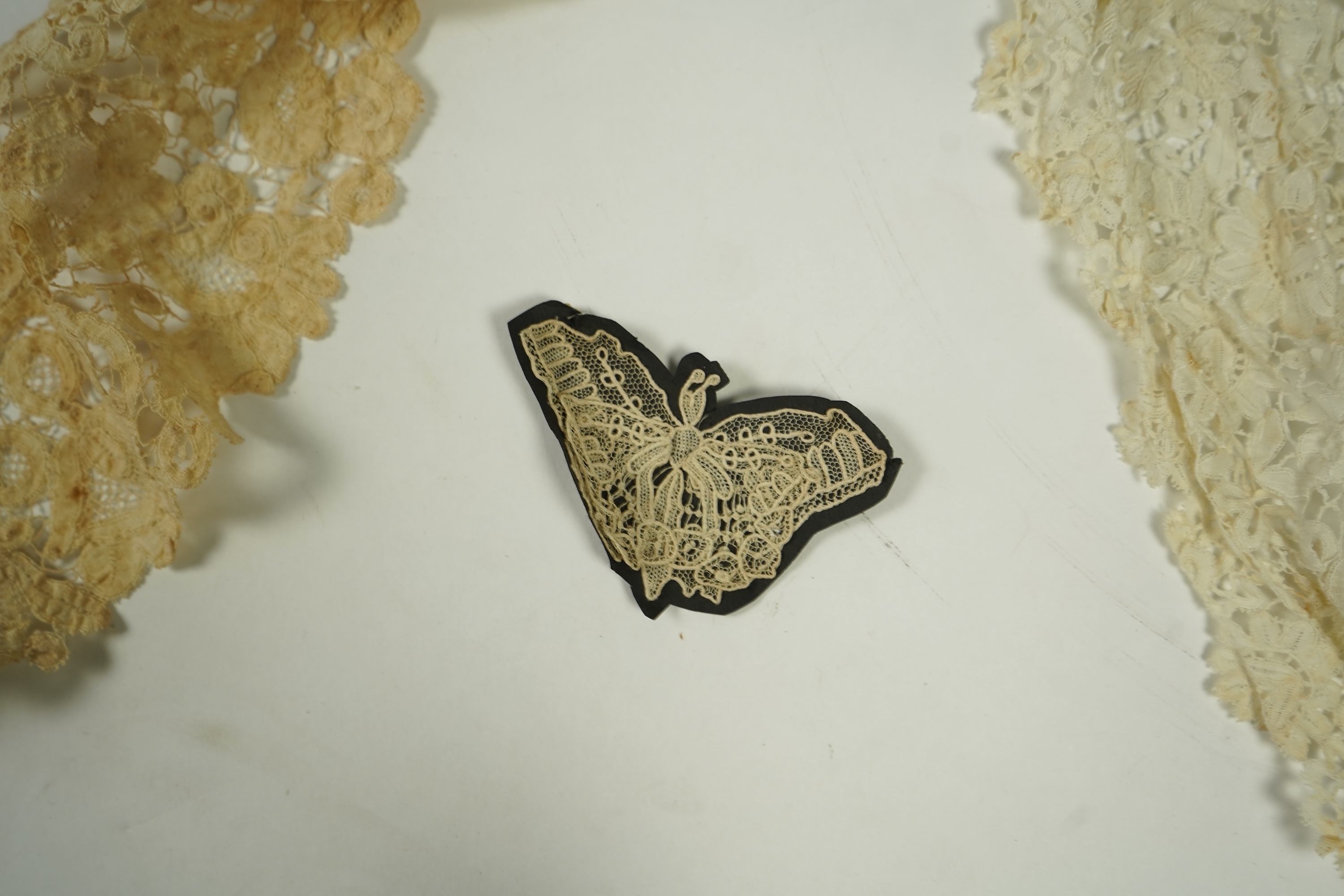 A mixed Brussels bobbin lace and Point de Gaze lace collar, another smaller collar, a similar length of trim and butterfly motif, together with a Brussels bobbin collar and trim, an Irish crochet cuffs, a Valenciennes la